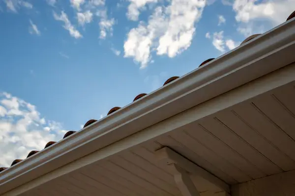 Close-up of seamless gutter system protecting a home