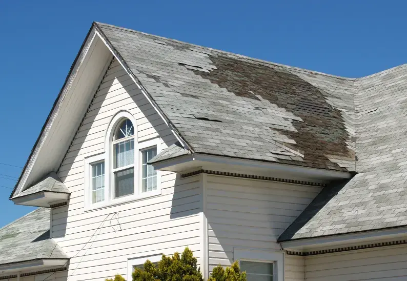 Storm Damage roof in Mahoning Valley home before repair